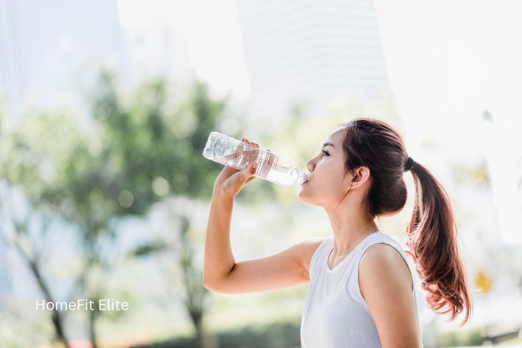 Athlete drinking water during outdoor training in Abu Dhabi heat